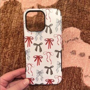 CASELY iPhone 16 pro max case. Christmas bows.